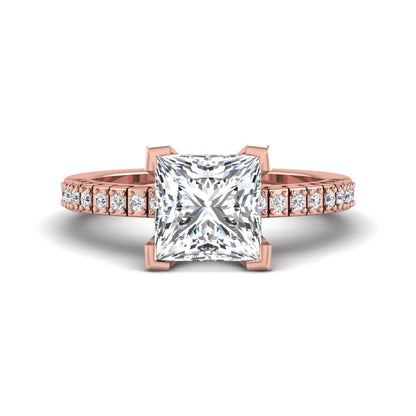 Princess cut lab grown diamond engagement ring featuring a four-prong setting with round accent diamonds on a geometric rose gold style band.
