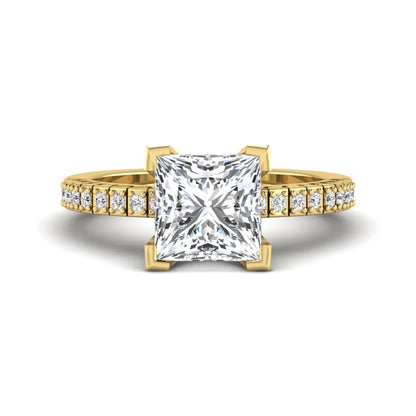 Princess cut lab grown diamond engagement ring featuring a four-prong setting with round accent diamonds on a geometric yellow gold style band.