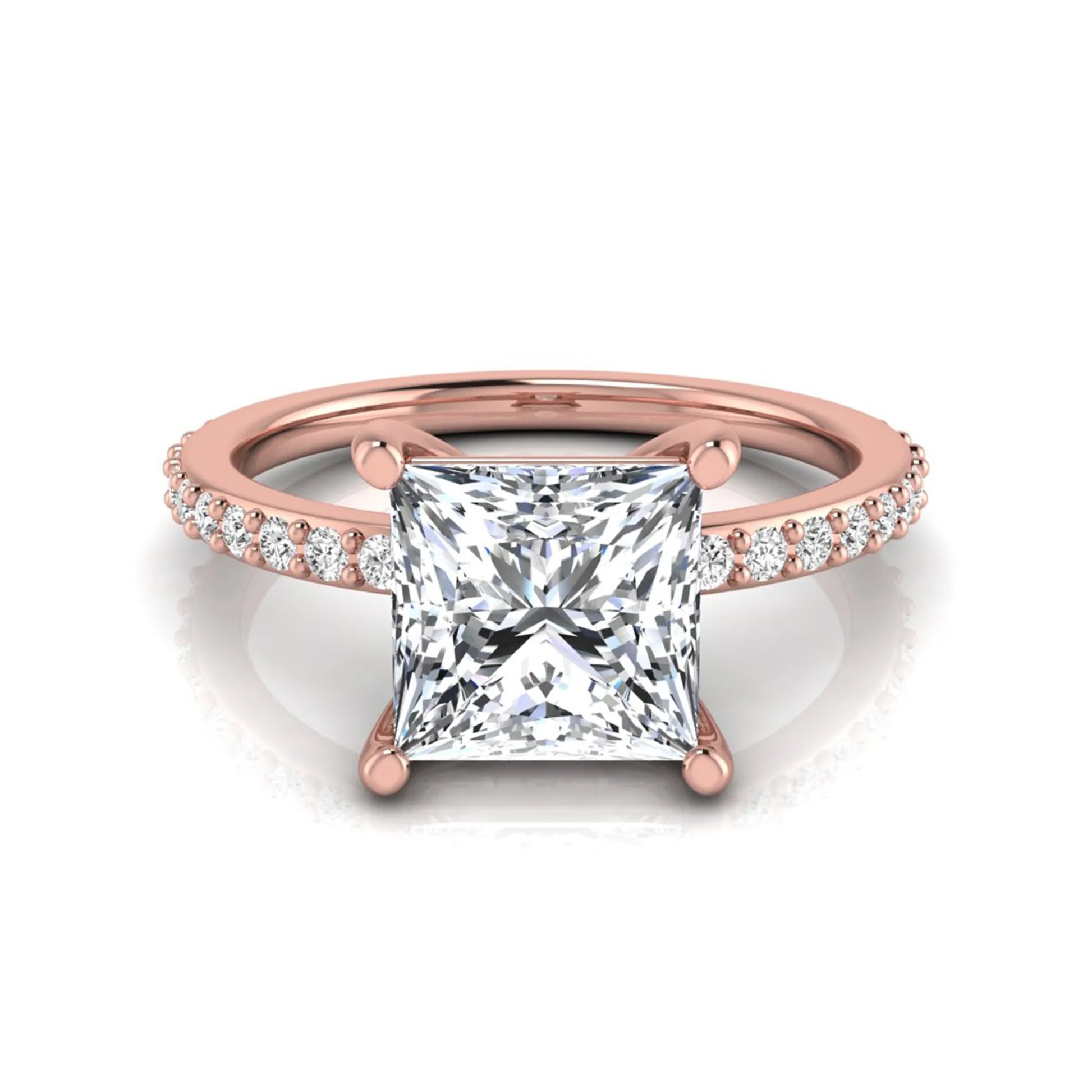 Princess cut four prong lab grown diamond engagement ring featuring a 1.96 carat IGI certified center diamond with round cut pavé diamonds on a classic solitaire band in rose gold