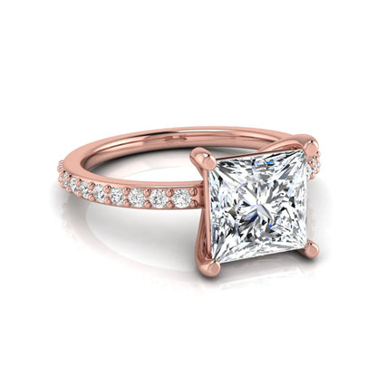 Princess cut four prong lab grown diamond engagement ring featuring a 1.96 carat IGI certified center diamond with round cut pavé diamonds on a classic solitaire band in rose gold