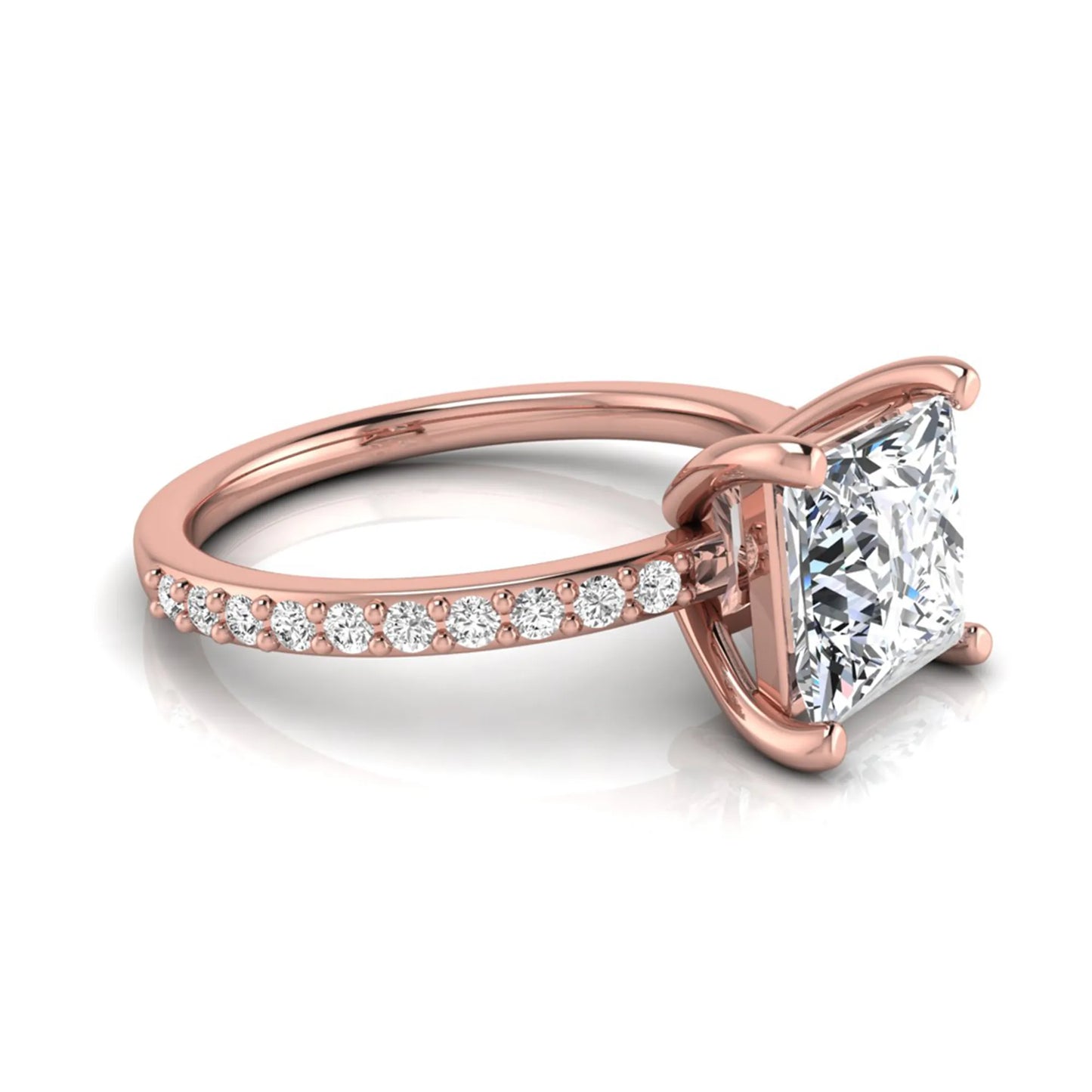 Princess cut four prong lab grown diamond engagement ring featuring a 1.96 carat IGI certified center diamond with round cut pavé diamonds on a classic solitaire band in rose gold