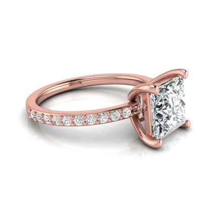 Princess cut four prong lab grown diamond engagement ring featuring a 1.96 carat IGI certified center diamond with round cut pavé diamonds on a classic solitaire band in rose gold
