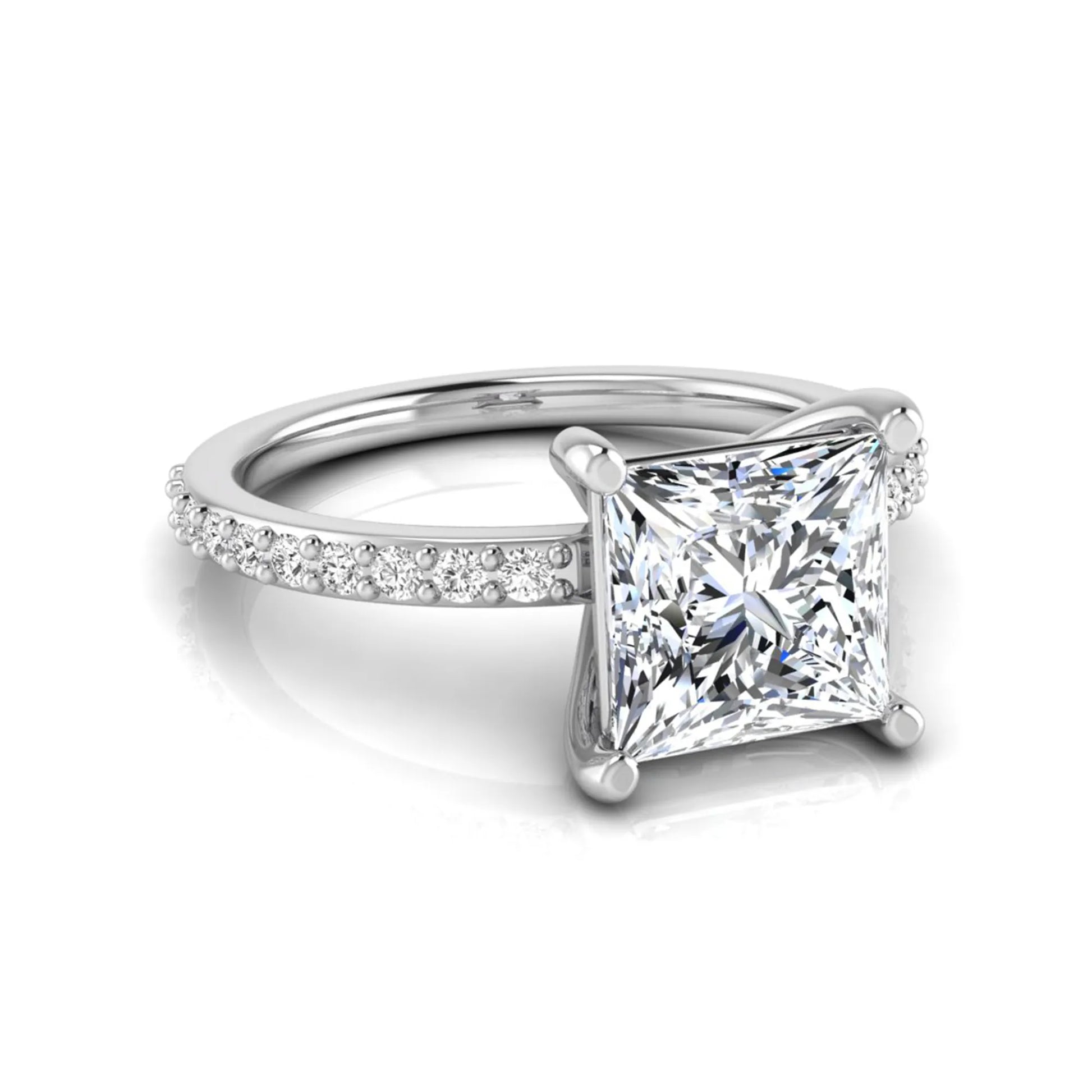 Princess cut four prong lab grown diamond engagement ring featuring a 1.96 carat IGI certified center diamond with round cut pavé diamonds on a classic solitaire band in white gold
