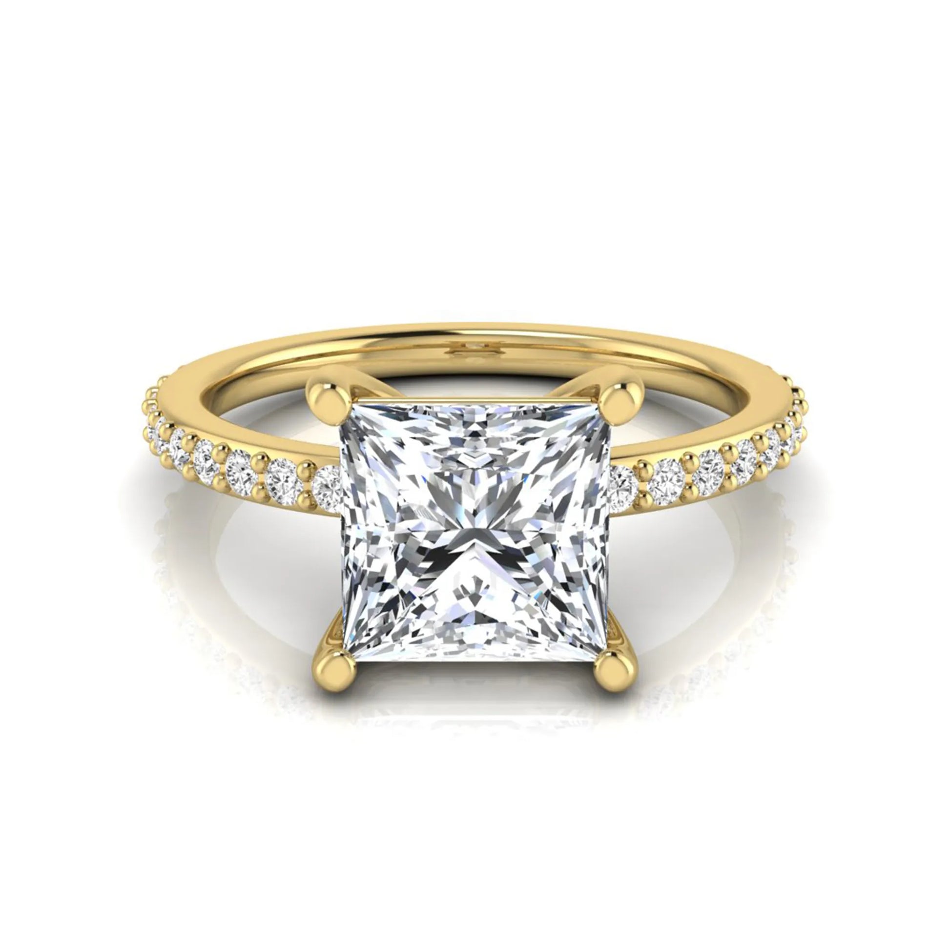Princess cut four prong lab grown diamond engagement ring featuring a 1.96 carat IGI certified center diamond with round cut pavé diamonds on a classic solitaire band in yellow gold