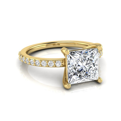 Princess cut four prong lab grown diamond engagement ring featuring a 1.96 carat IGI certified center diamond with round cut pavé diamonds on a classic solitaire band in yellow gold