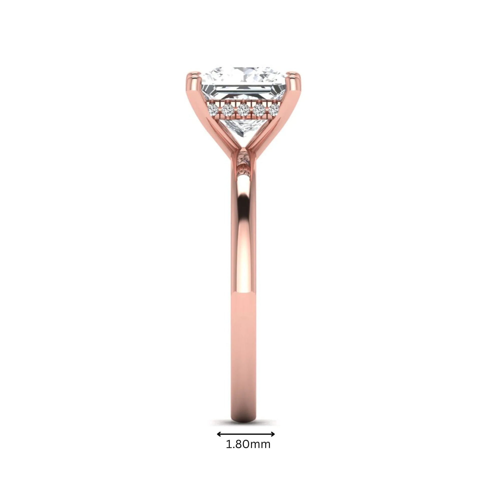 Princess cut lab grown diamond hidden halo solitaire engagement ring with four-prong setting and rose gold tone band.