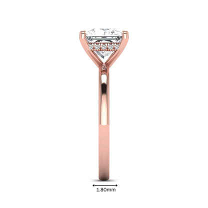 Princess cut lab grown diamond hidden halo solitaire engagement ring with four-prong setting and rose gold tone band.