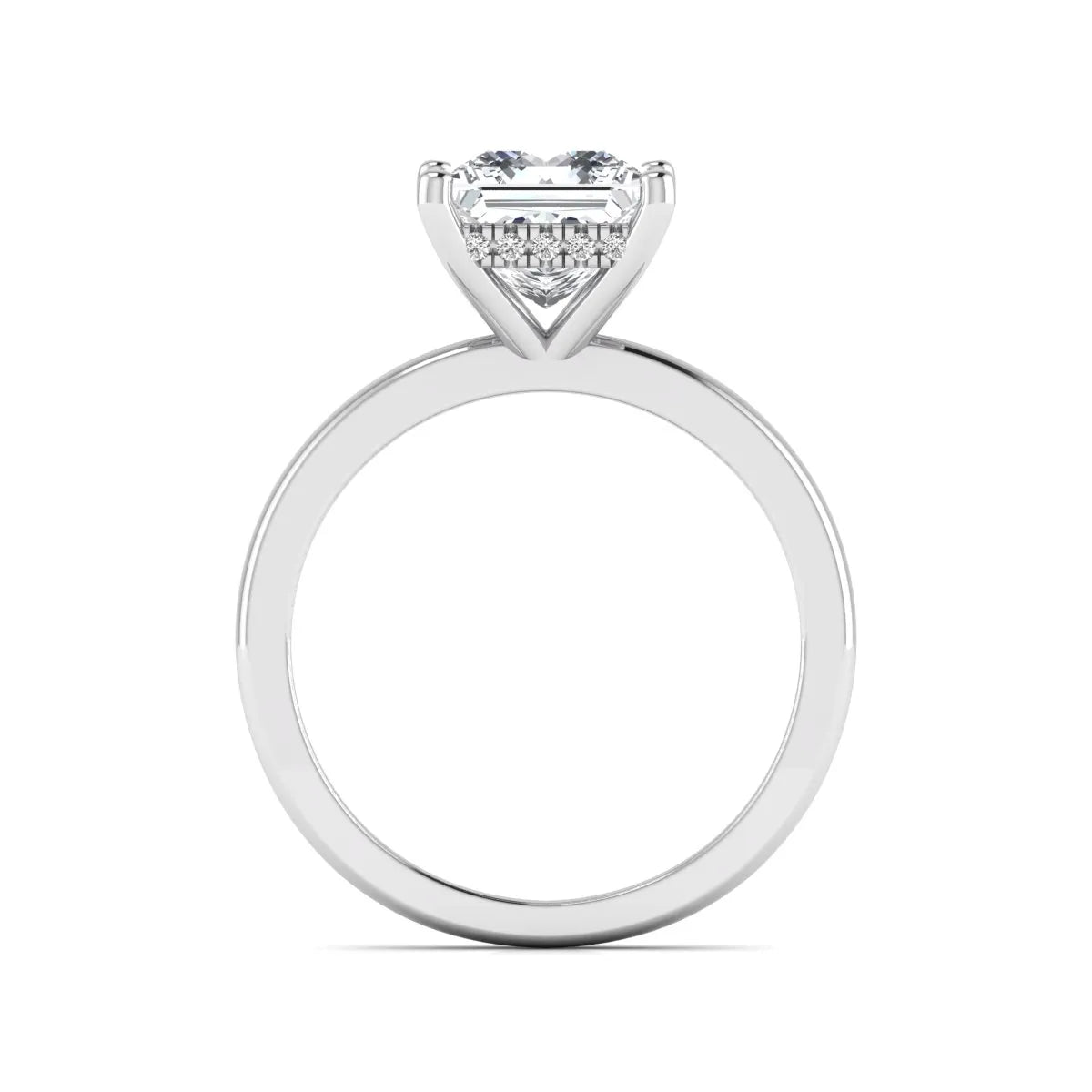 Princess cut lab grown diamond hidden halo solitaire engagement ring with four-prong setting and white gold tone band.