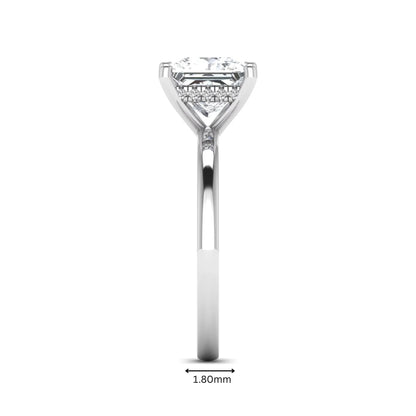Princess cut lab grown diamond hidden halo solitaire engagement ring with four-prong setting and white gold tone band.