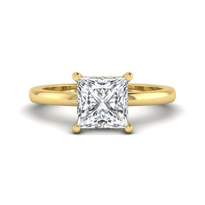 Princess cut lab grown diamond hidden halo solitaire engagement ring with four-prong setting and yellow gold tone band.