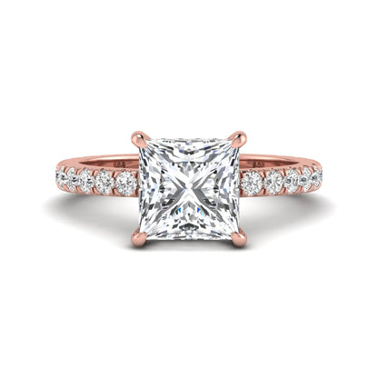 IGI certified princess cut lab grown diamond hidden halo solitaire accent engagement ring with pavé diamond band in rose gold.