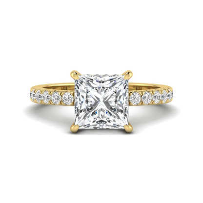 IGI certified princess cut lab grown diamond hidden halo solitaire accent engagement ring with pavé diamond band in yellow gold.