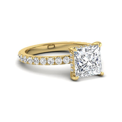 IGI certified princess cut lab grown diamond hidden halo solitaire accent engagement ring with pavé diamond band in yellow gold.