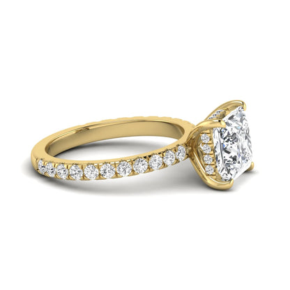 IGI certified princess cut lab grown diamond hidden halo solitaire accent engagement ring with pavé diamond band in yellow gold.