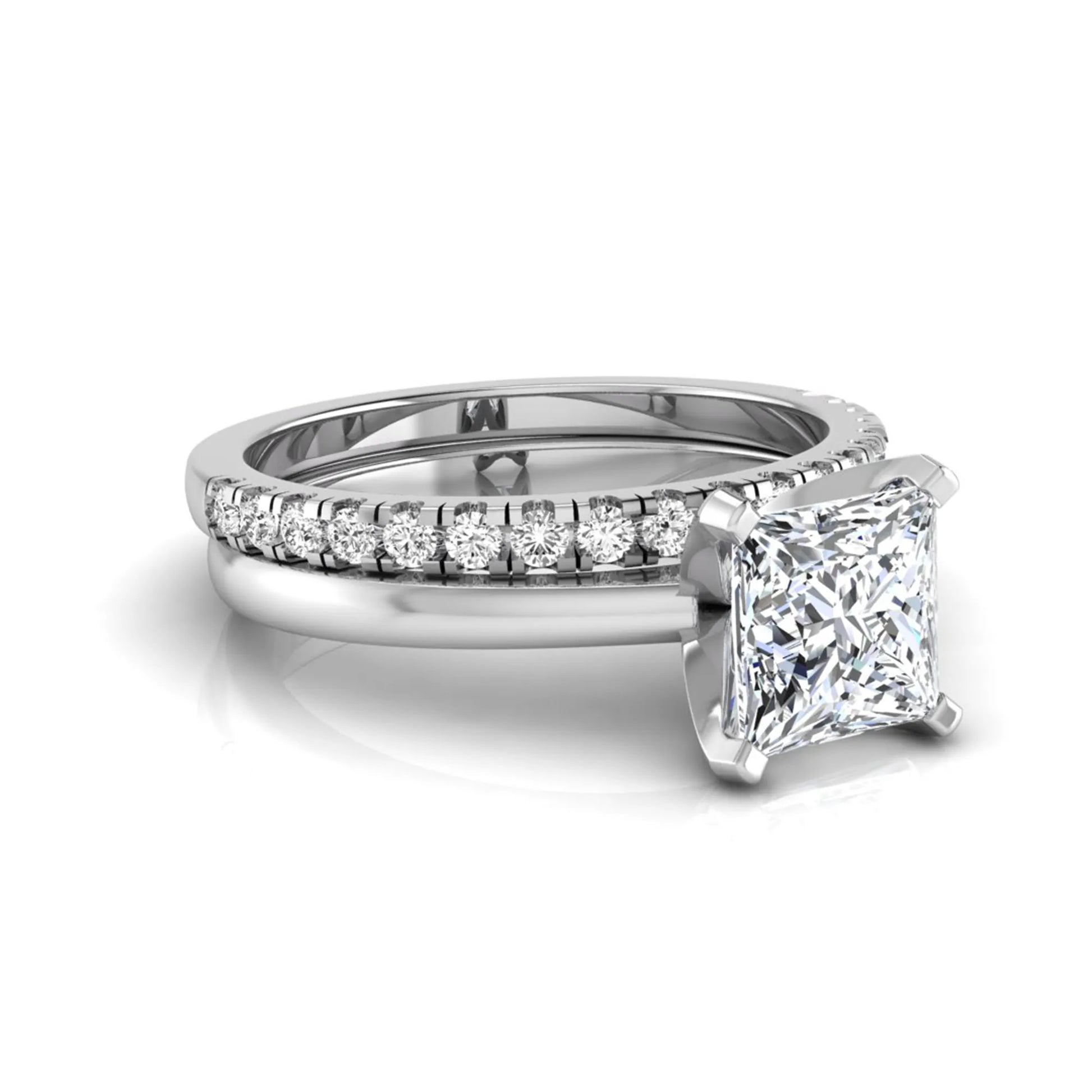 Princess cut lab grown diamond bridal ring set with matching pavé diamond wedding band in white gold.