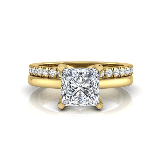 Princess cut lab grown diamond bridal ring set with matching pavé diamond wedding band in yellow gold.
