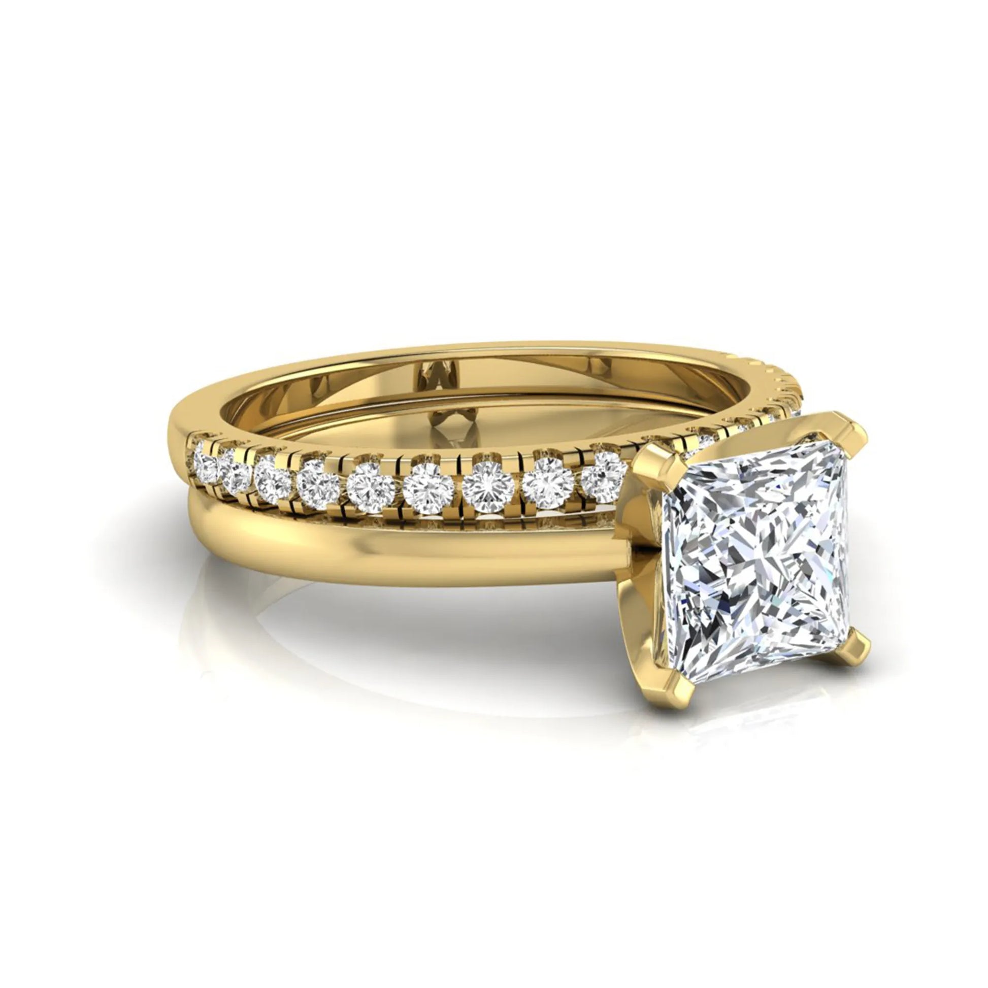 Princess cut lab grown diamond bridal ring set with matching pavé diamond wedding band in yellow gold.