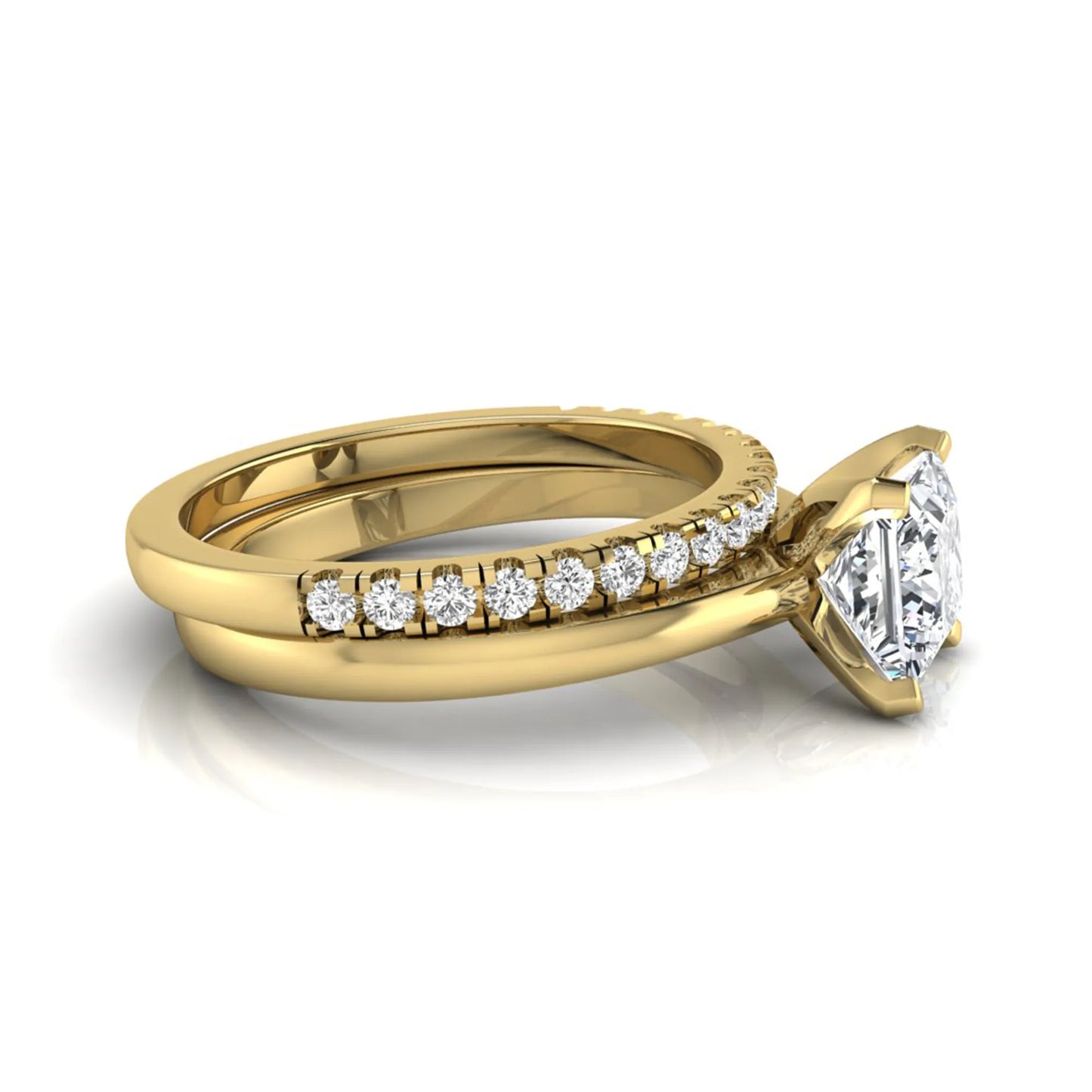 Princess cut lab grown diamond bridal ring set with matching pavé diamond wedding band in yellow gold.