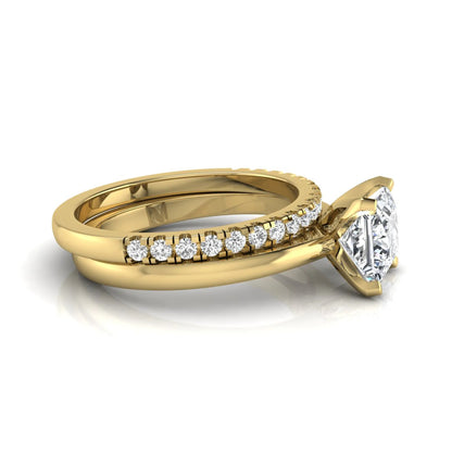 Princess cut lab grown diamond bridal ring set with matching pavé diamond wedding band in yellow gold.