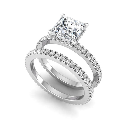 Princess cut lab grown diamond bridal ring set featuring a 1.96 carat IGI certified center diamond, hidden halo engagement ring, and matching round diamond eternity wedding band in white gold.