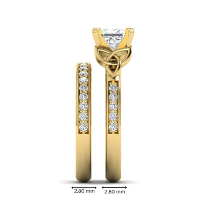 Princess cut lab grown diamond Celtic knot bridal ring set featuring a matching pavé diamond wedding band in yellow gold.