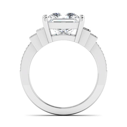 Princess cut lab grown diamond engagement ring featuring a 4.12 carat IGI certified center diamond with channel set round side diamonds in white gold.