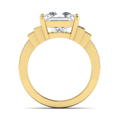 Princess cut lab grown diamond engagement ring featuring a 4.12 carat IGI certified center diamond with channel set round side diamonds in yellow gold.