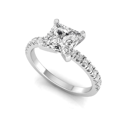 Princess cut lab grown diamond side stone accent engagement ring featuring a 2.40 carat IGI certified center diamond with round brilliant accent diamonds in white gold.