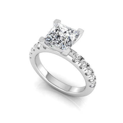 Princess cut lab grown diamond engagement ring featuring a 1.96 carat IGI certified center diamond with round side stone accents in white gold.