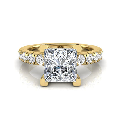 Princess cut lab grown diamond engagement ring featuring a 1.96 carat IGI certified center diamond with round side stone accents in yellow gold.