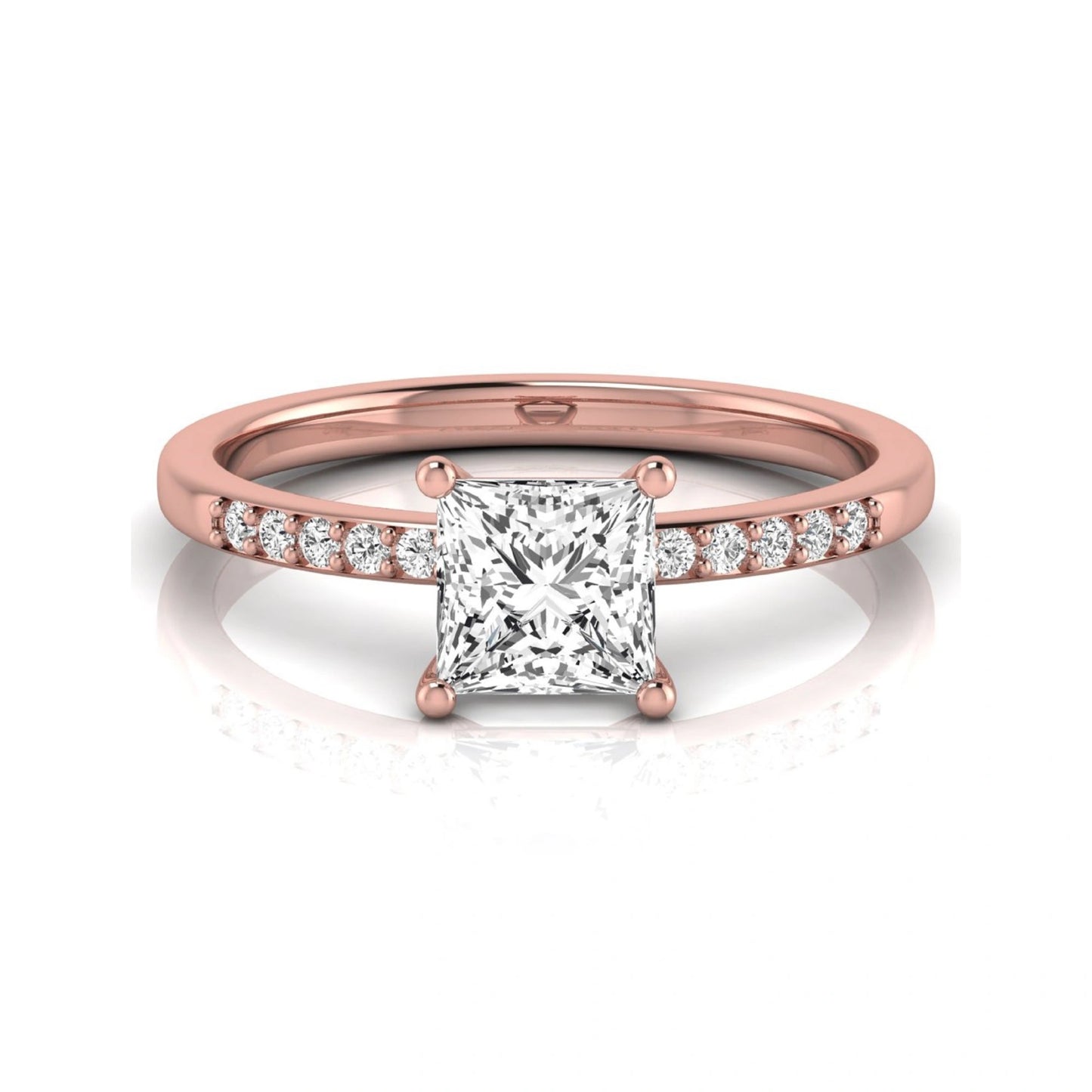 Princess cut lab grown diamond side stone engagement ring featuring a 1.24 carat IGI certified princess cut diamond with pavé round side diamonds in a rose gold setting.