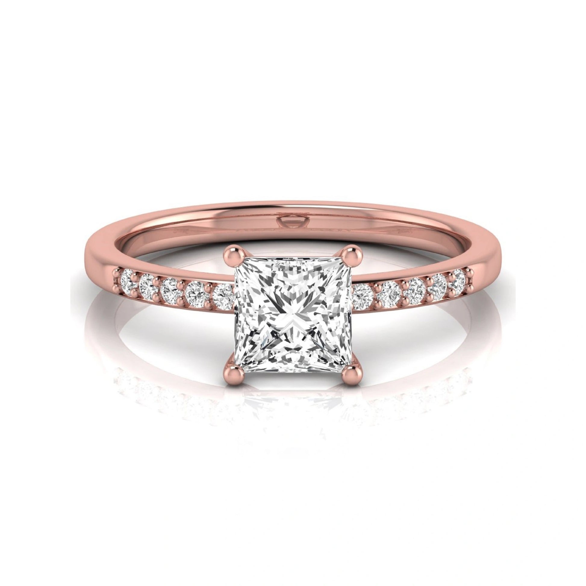 Princess cut lab grown diamond side stone engagement ring featuring a 1.24 carat IGI certified princess cut diamond with pavé round side diamonds in a rose gold setting.