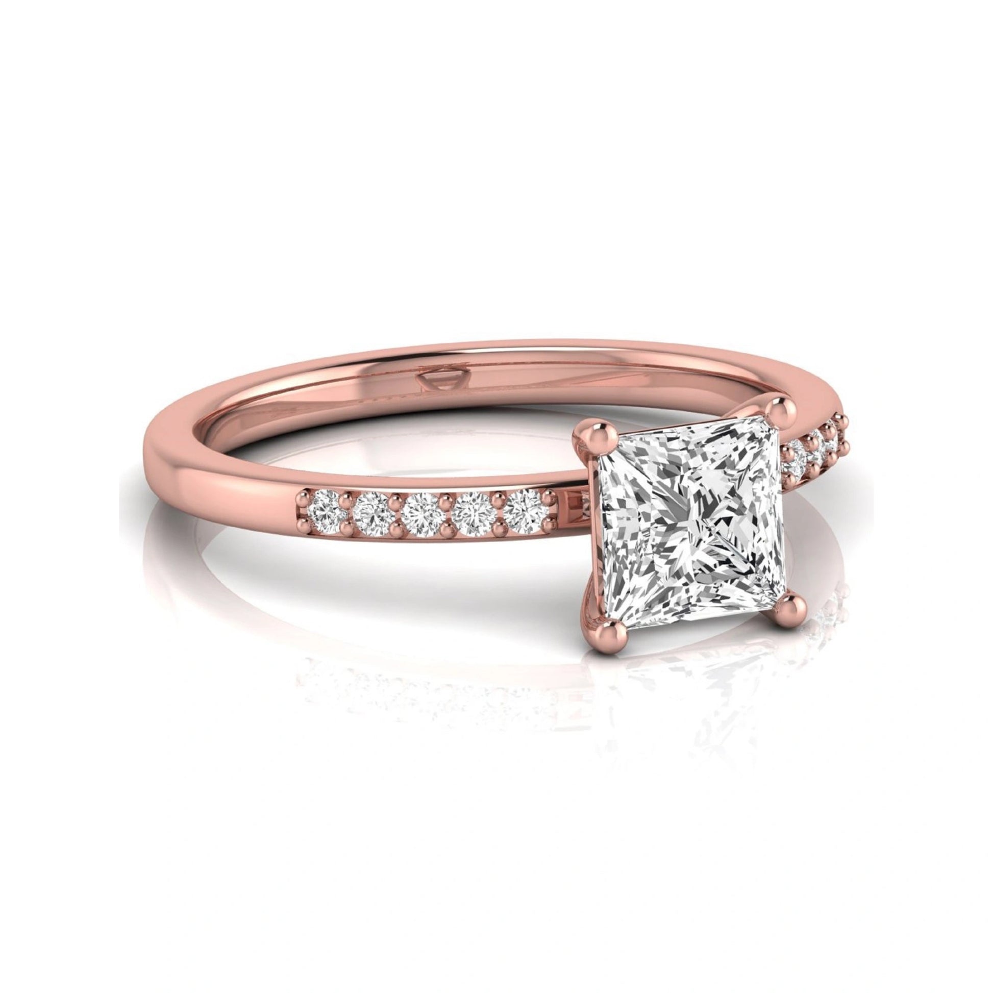 Princess cut lab grown diamond side stone engagement ring featuring a 1.24 carat IGI certified princess cut diamond with pavé round side diamonds in a rose gold setting.