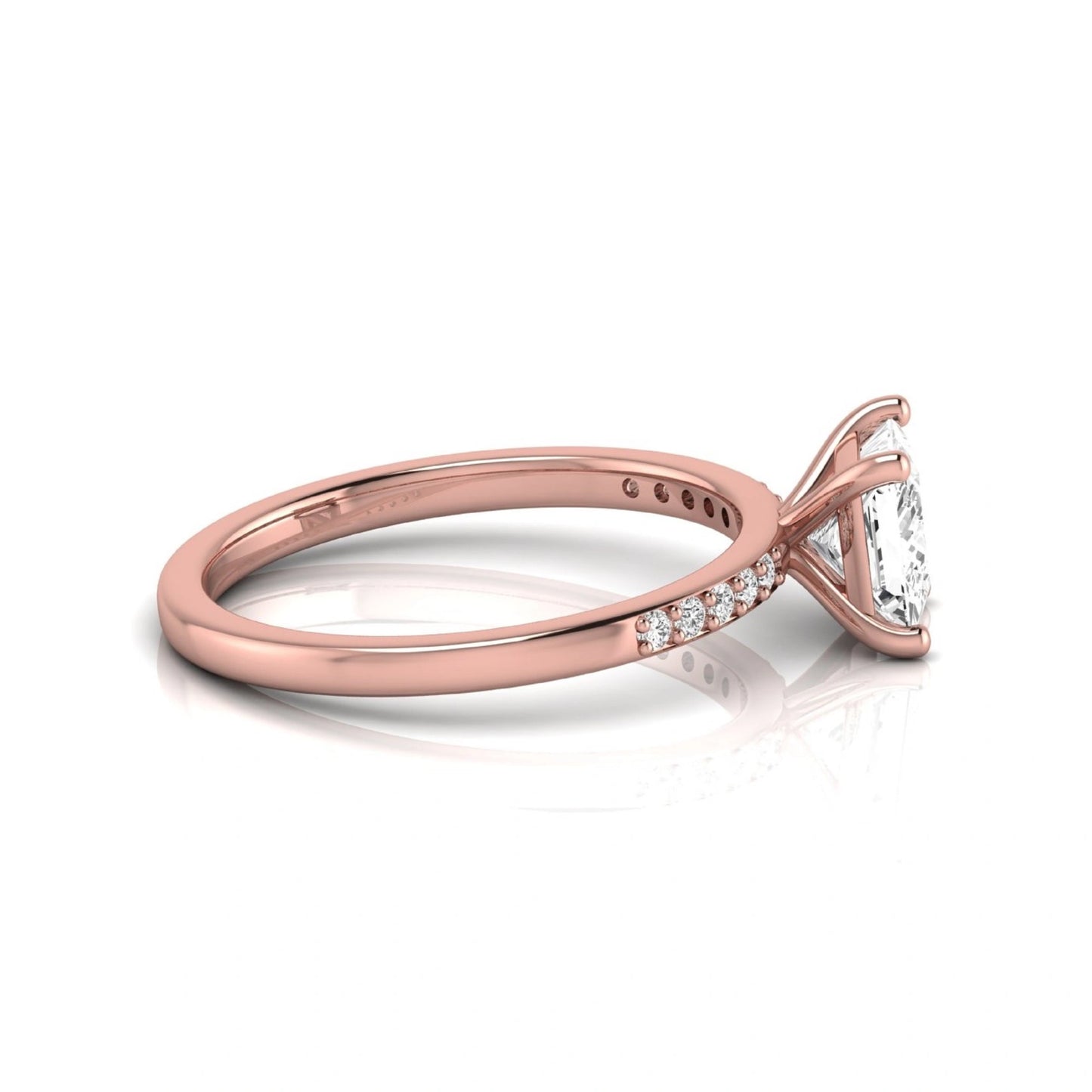 Princess cut lab grown diamond side stone engagement ring featuring a 1.24 carat IGI certified princess cut diamond with pavé round side diamonds in a rose gold setting.