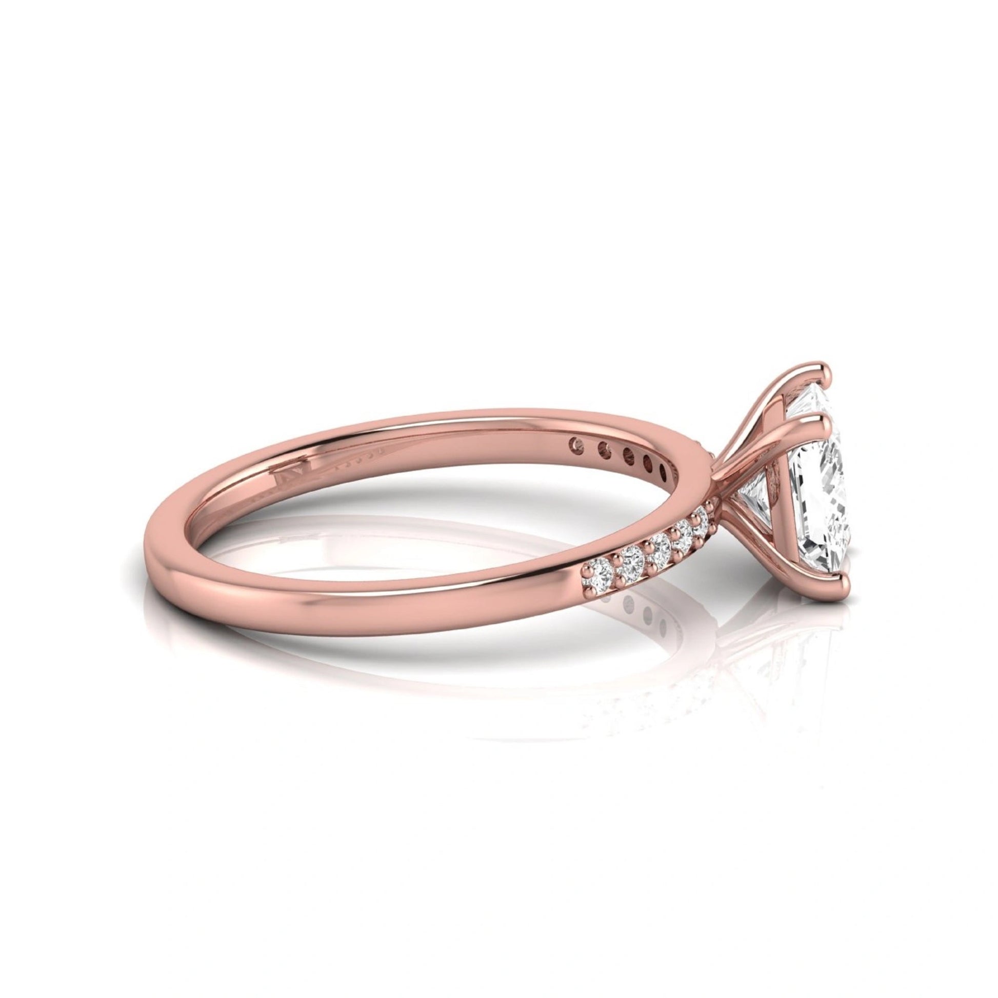Princess cut lab grown diamond side stone engagement ring featuring a 1.24 carat IGI certified princess cut diamond with pavé round side diamonds in a rose gold setting.