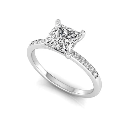 Princess cut lab grown diamond side stone engagement ring featuring a 1.24 carat IGI certified princess cut diamond with pavé round side diamonds in a white gold setting.