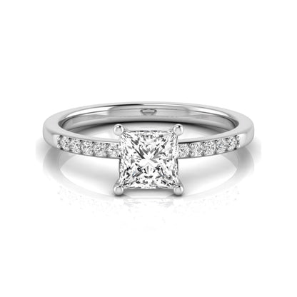 Princess cut lab grown diamond side stone engagement ring featuring a 1.24 carat IGI certified princess cut diamond with pavé round side diamonds in a white gold setting.