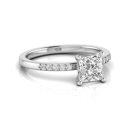 Princess cut lab grown diamond side stone engagement ring featuring a 1.24 carat IGI certified princess cut diamond with pavé round side diamonds in a white gold setting.