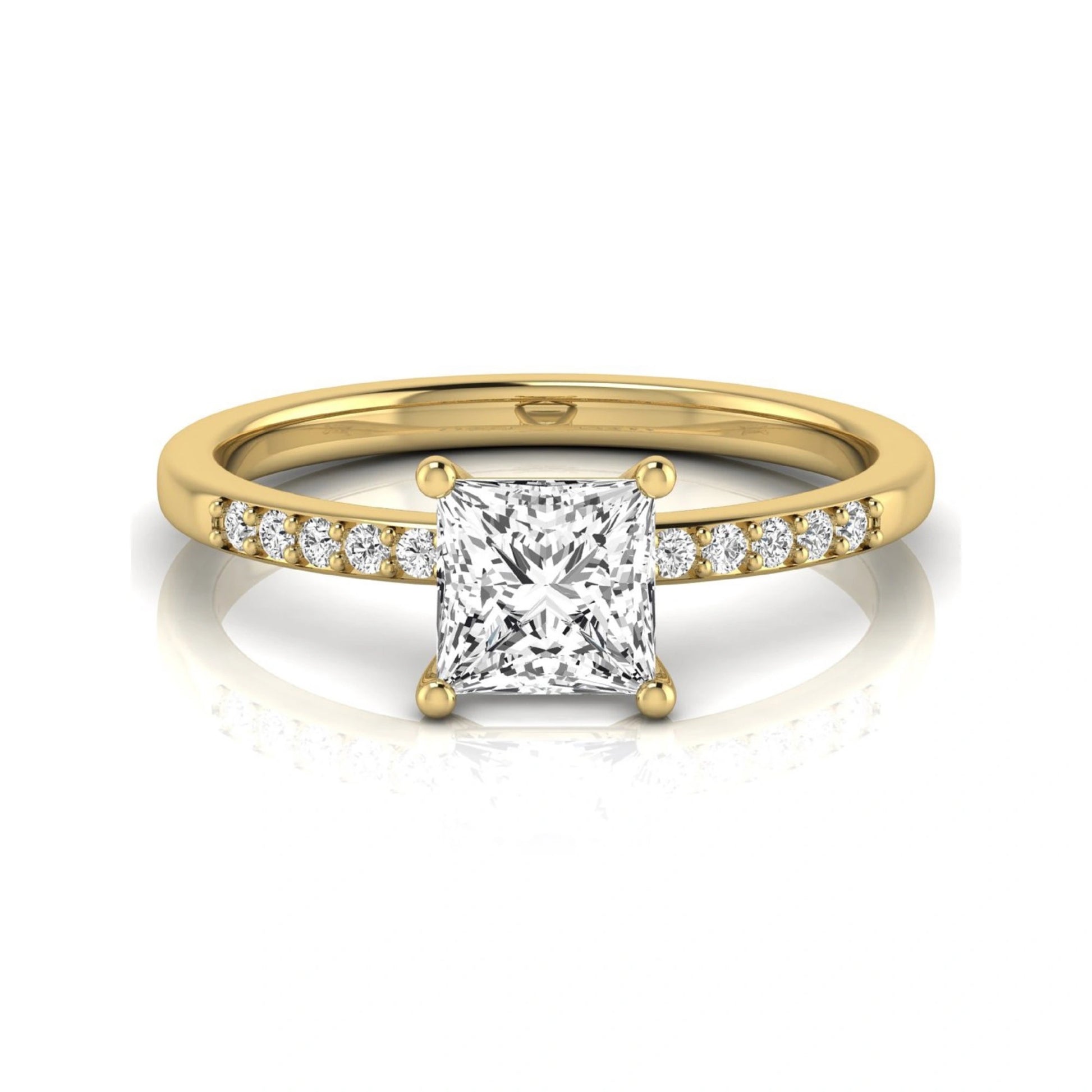Princess cut lab grown diamond side stone engagement ring featuring a 1.24 carat IGI certified princess cut diamond with pavé round side diamonds in a yellow gold setting.