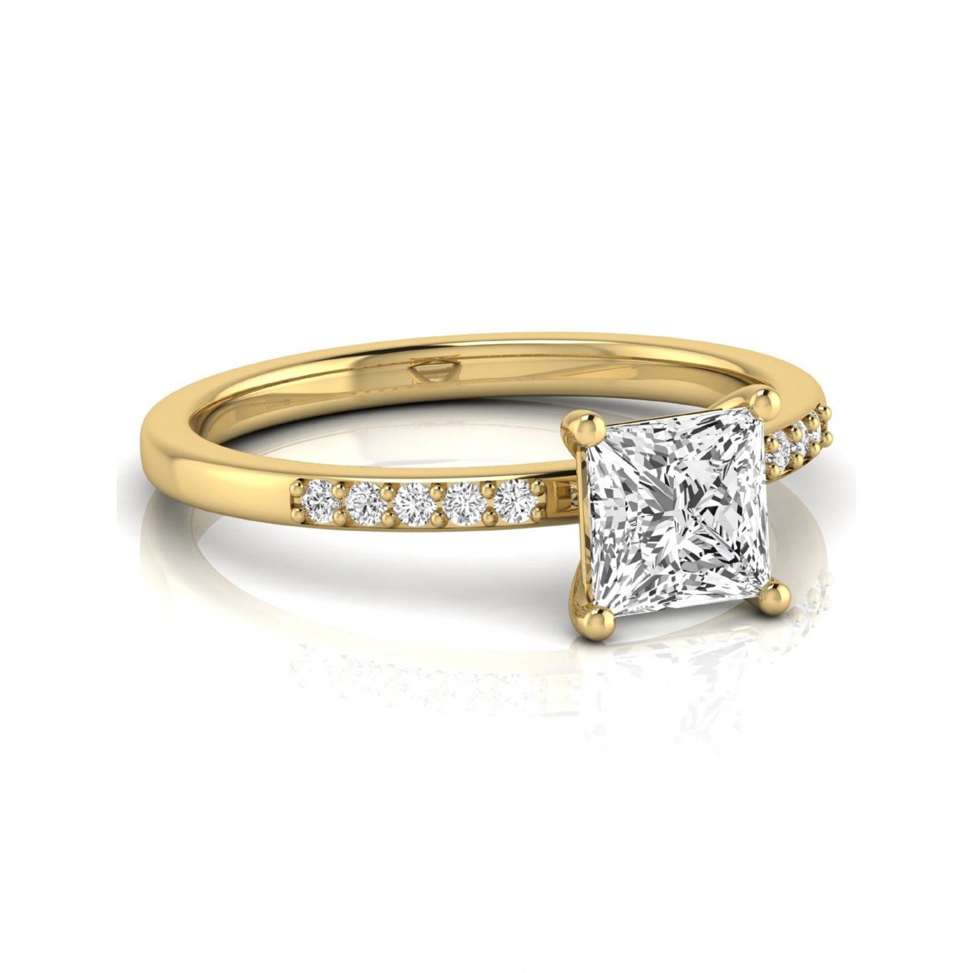 Princess cut lab grown diamond side stone engagement ring featuring a 1.24 carat IGI certified princess cut diamond with pavé round side diamonds in a yellow gold setting.