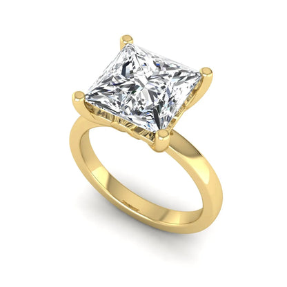 Princess cut lab grown diamond solitaire engagement ring featuring a 3.01 carat IGI certified center diamond in yellow gold.