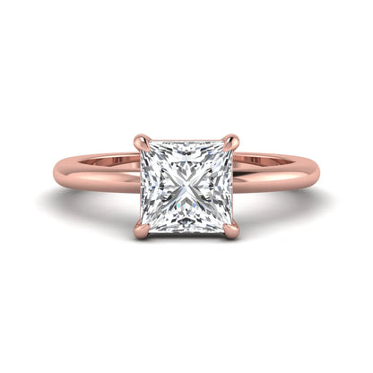 Princess cut lab grown diamond solitaire engagement ring with four-prong setting and rose gold tone band.