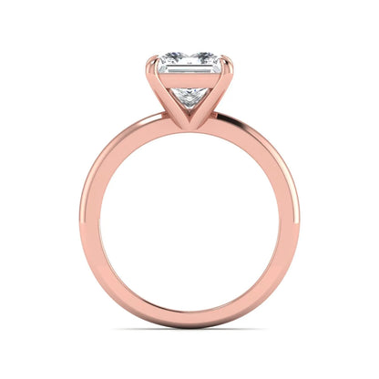 Princess cut lab grown diamond solitaire engagement ring with four-prong setting and rose gold tone band.