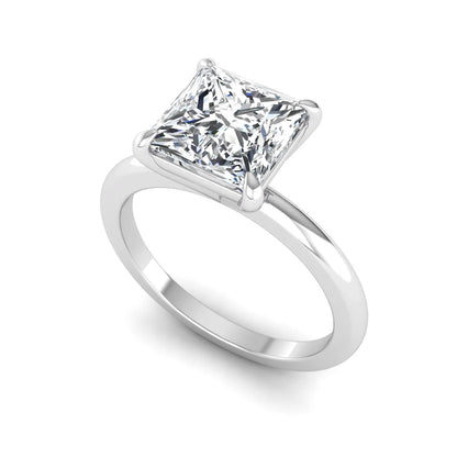 Princess cut lab grown diamond solitaire engagement ring with four-prong setting and white gold tone band.