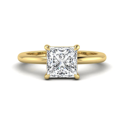 Princess cut lab grown diamond solitaire engagement ring with four-prong setting and yellow gold tone band.