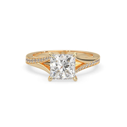 yellow Gold ring with a lab grown diamond on a white background