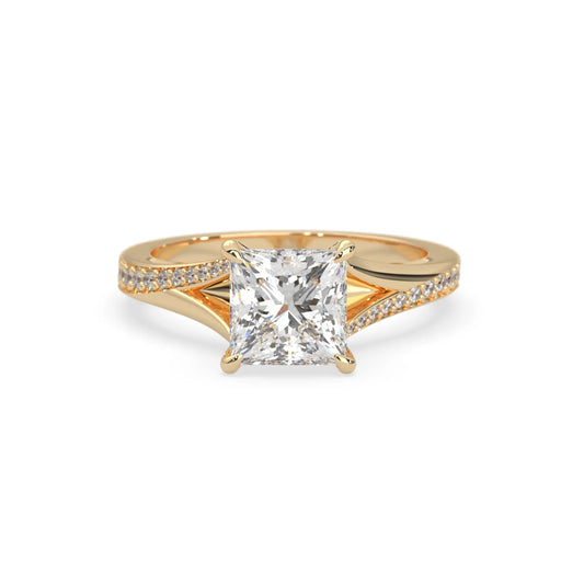 yellow Gold ring with a lab grown diamond on a white background