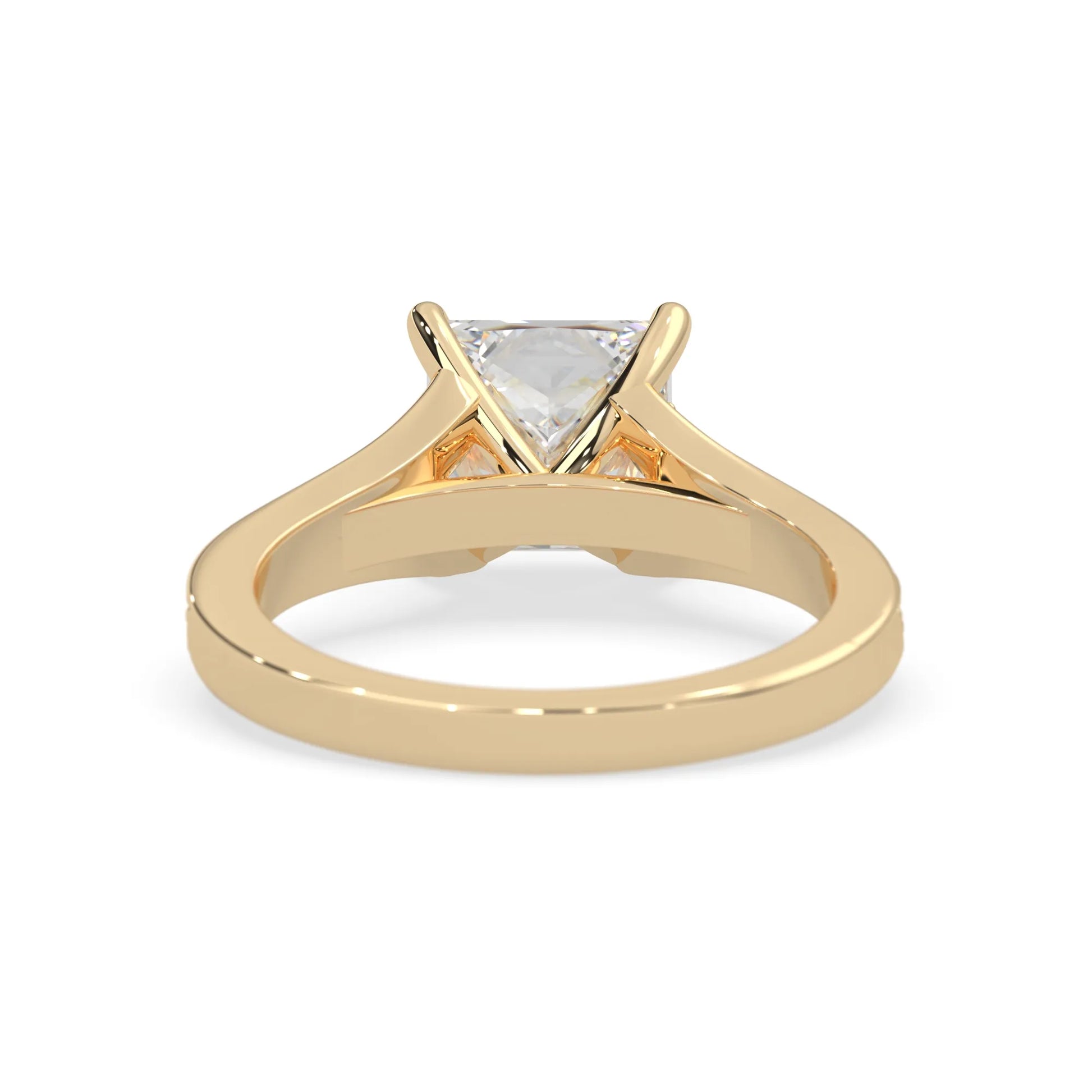 yellow Gold ring with a lab grown diamond on a white background