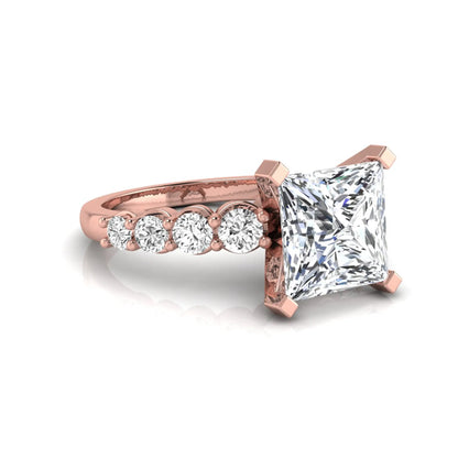 Princess cut lab grown diamond engagement ring with round side diamonds in rose gold.