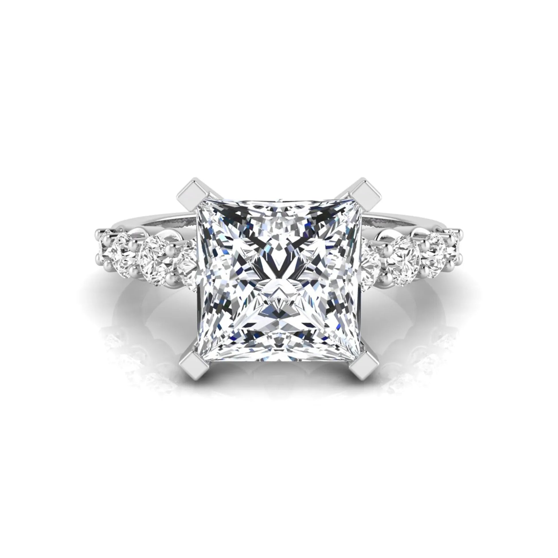 Princess cut lab grown diamond engagement ring with round side diamonds in white gold.